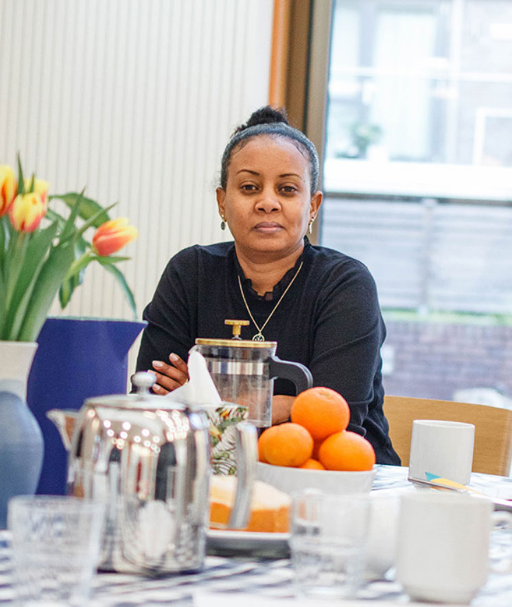 woman sitting at table attending Kids Matter parenting programme
