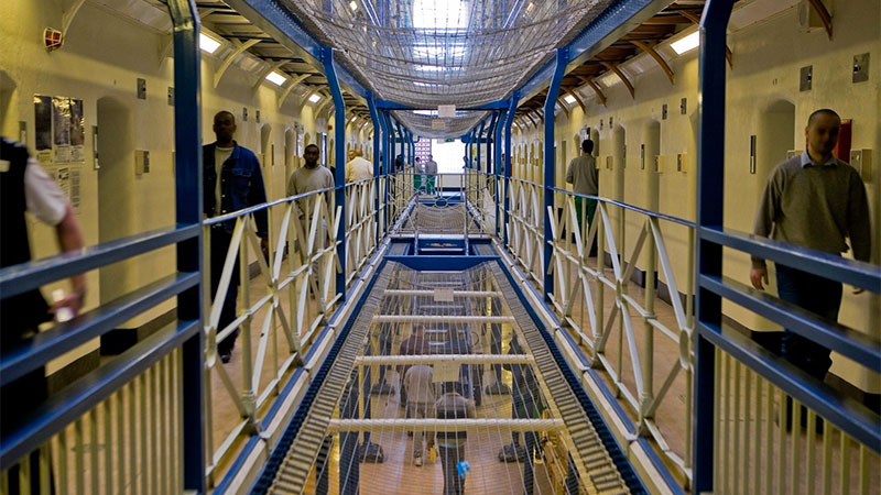 men walking inside prison